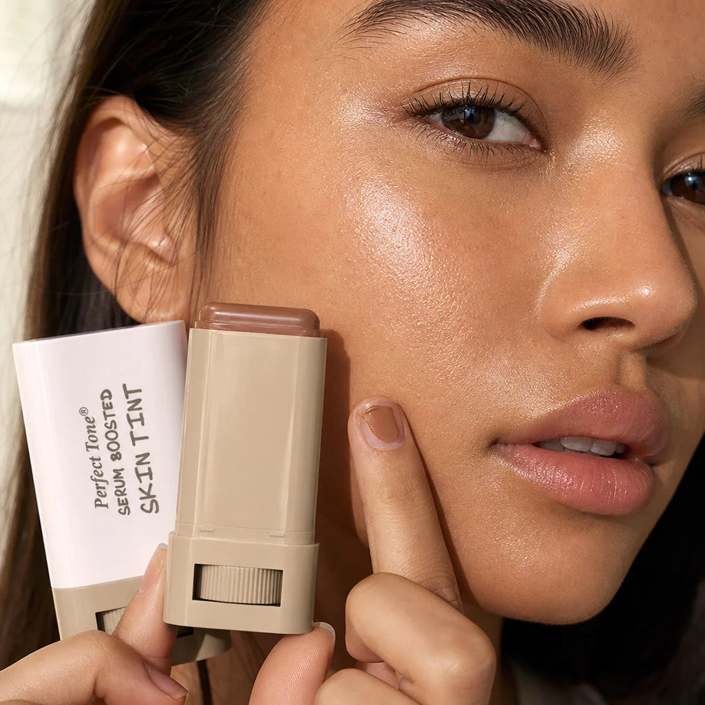 Close-up of a woman's hydrated, dewy cheek after applying the Perfect Tone Essential Skin Tint stick